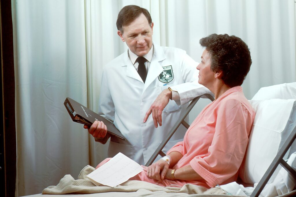 Medical professionals in a doctors office working with patients. 